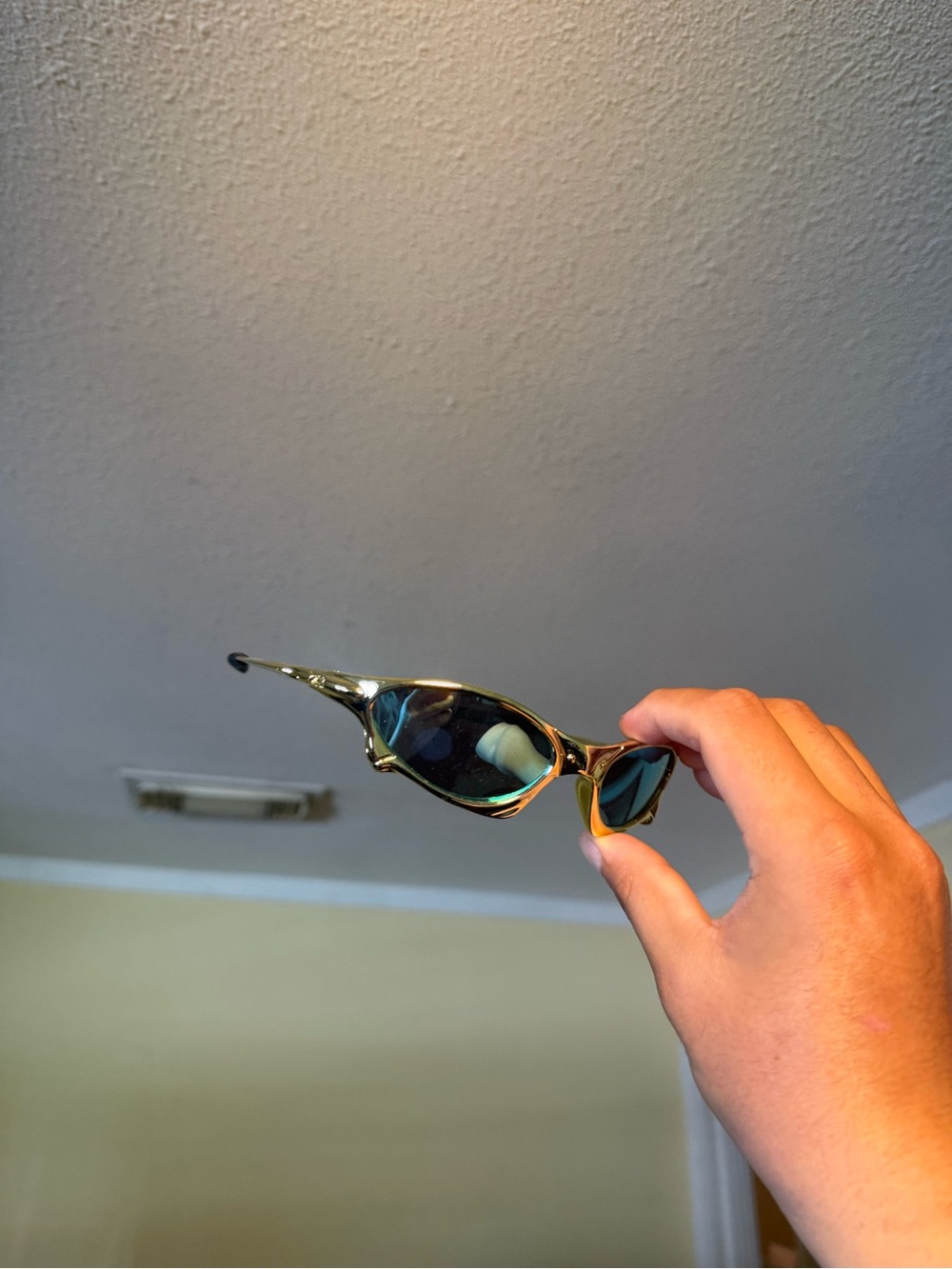 Retro Cat-Eye Sunglasses in Metallic Gold with Dark Green Lenses Oakley